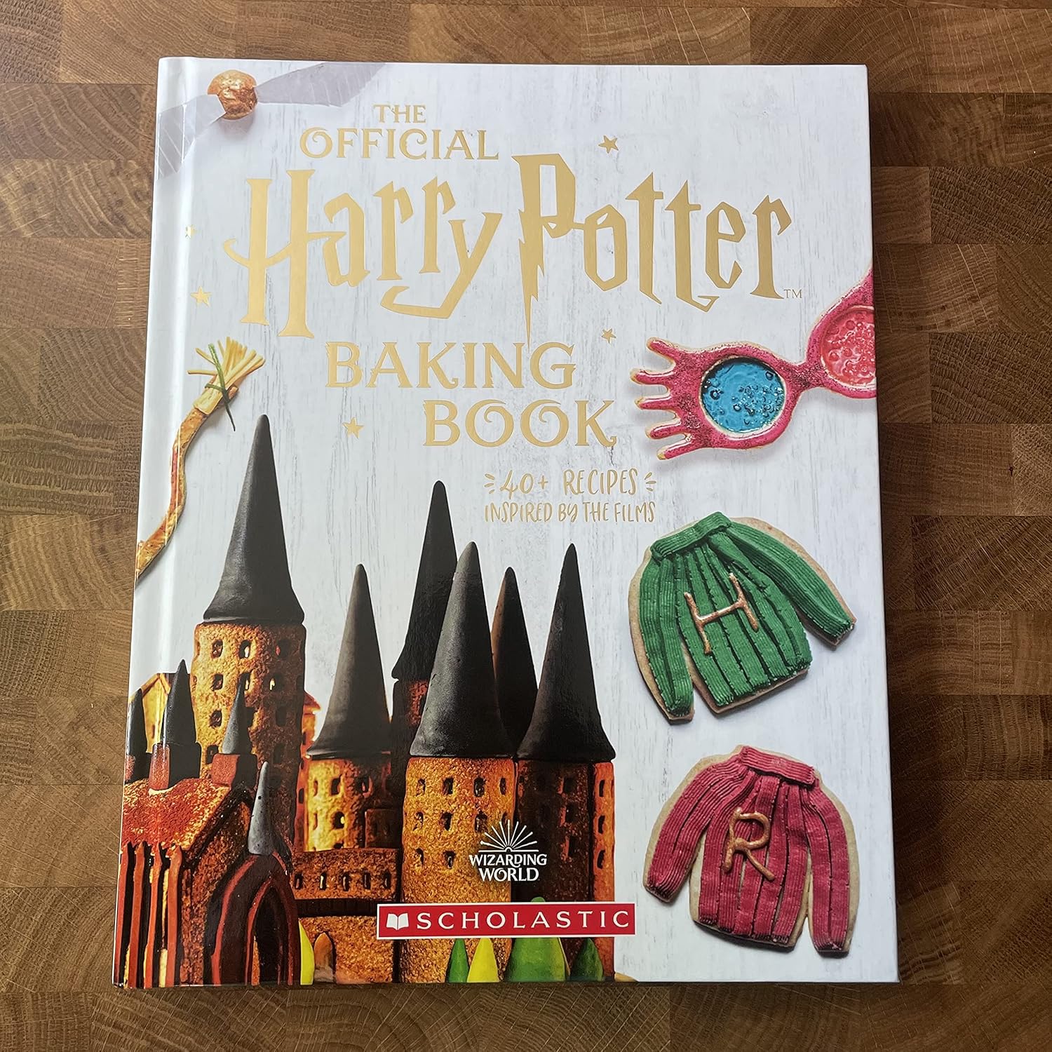 The Official Harry Potter baking book on top of a wooden table
