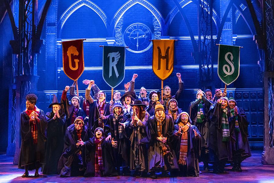 HPCC-north-american-tour-hogwarts-students-holding-house-banner-web-landscape