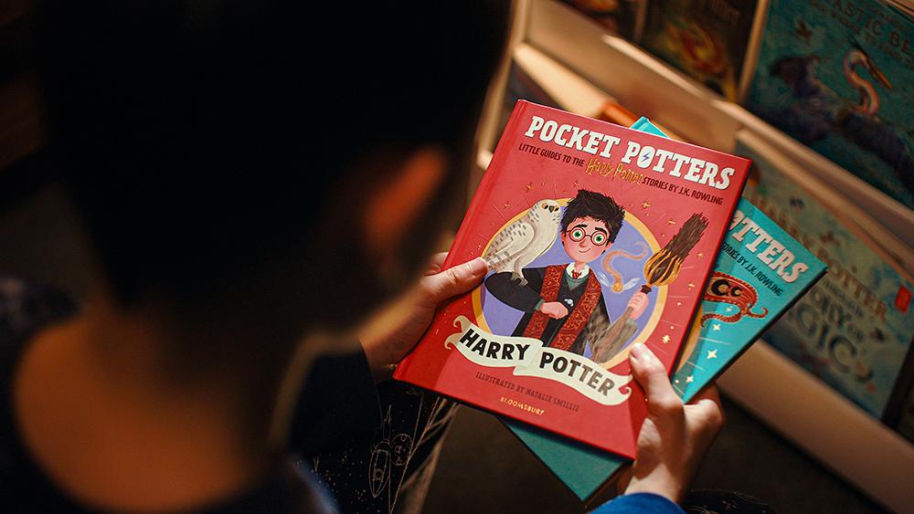 pocket-potters-kid-holding-books-web-header